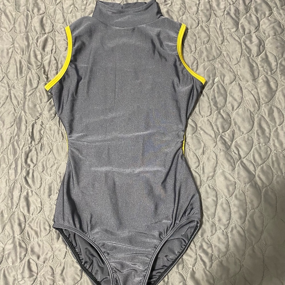 Silver turtle neck leotard with yellow piping